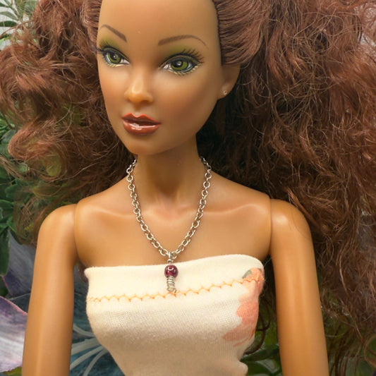 Red Drop Silver Spiral Pendant Doll Necklace. Necklace chain measures 3 7/8 inches long. Necklace shown on 16” Spellbound Valentina doll