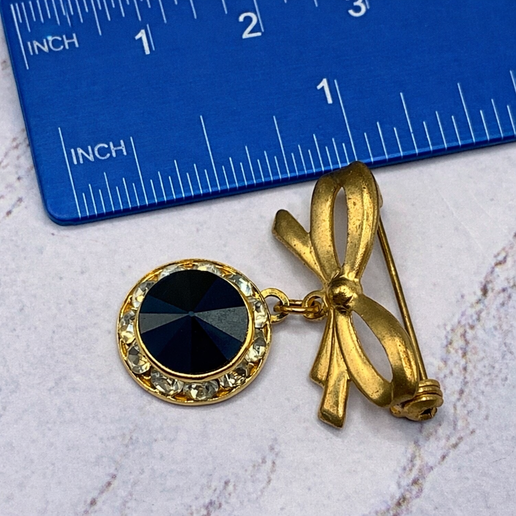 Gold Tone Bow Pin Black & Clear Rhinestone Dangle Doll Brooch