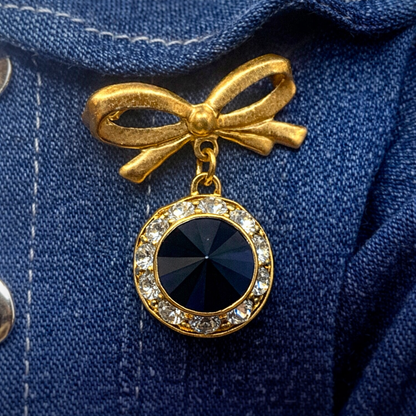 Gold Tone Bow Pin Black & Clear Rhinestone Dangle Doll Brooch