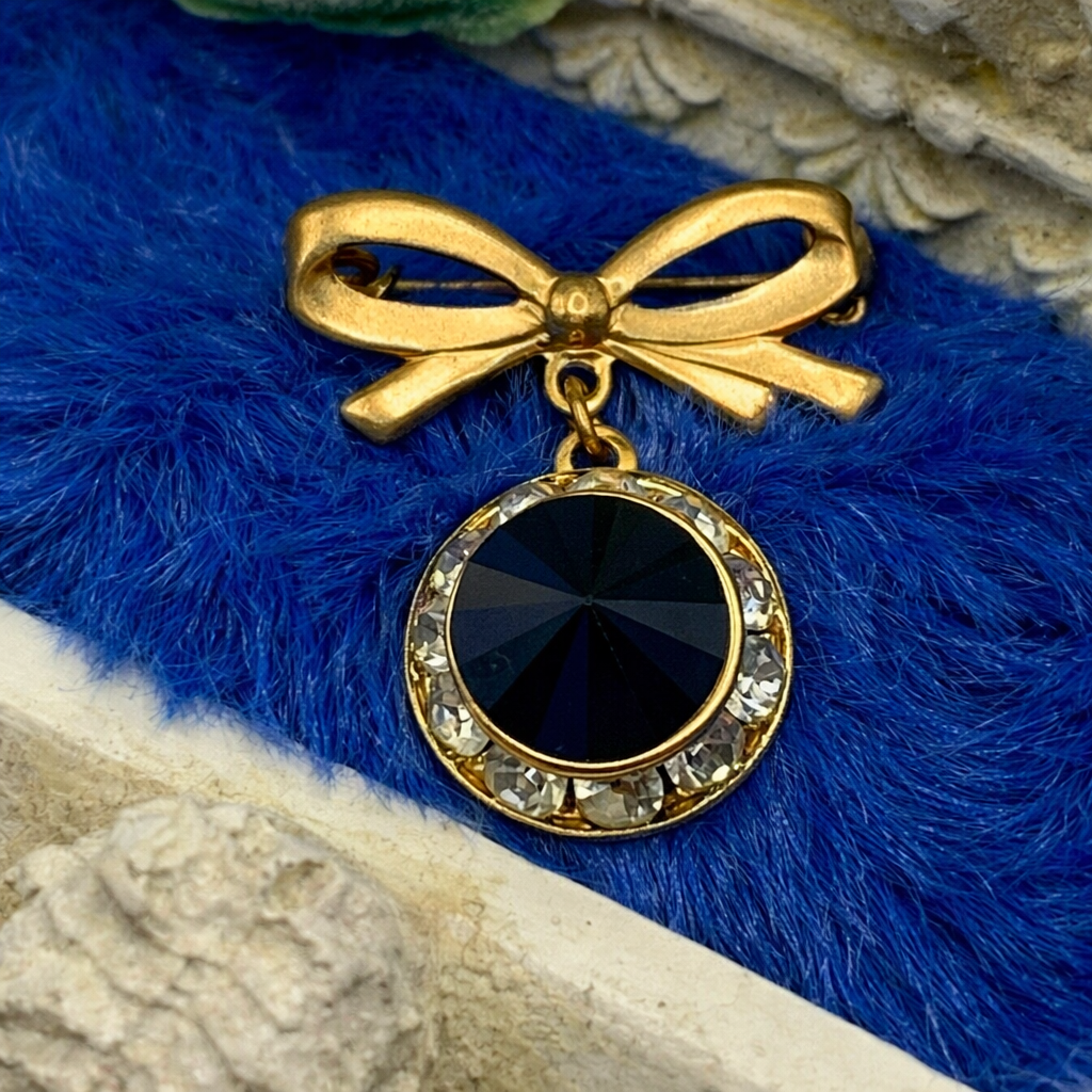 Gold Tone Bow Pin Black & Clear Rhinestone Dangle Doll Brooch
