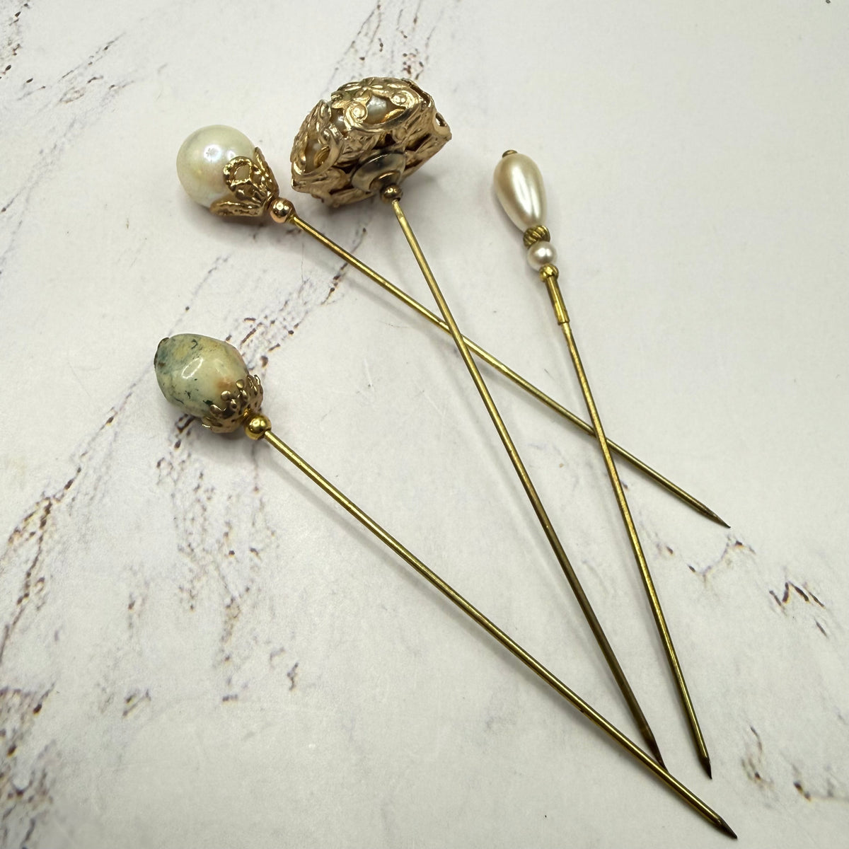 ✨ Handmade Vintage-Inspired Hatpin | Stick Pin | Hat Accessory | Sweater & Hijab Pin | Decorative Jewelry Gift for Her ✨

Set of 4 Stick Pins: Faux Pearl Multi Shape Gold Tone Filigree Ornate Design
