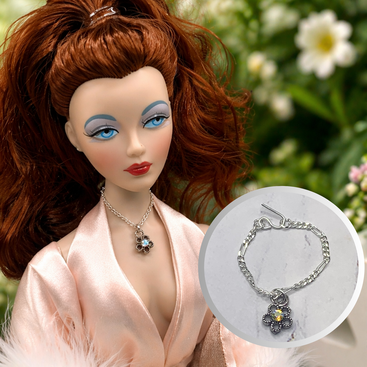 Aurora Borealis Rhinestone Flower Pendant Silver Tone Chain Doll Necklace. The necklace is 2.75 inches long.
Necklace shown on 16” Ashton Drake - Gene doll.