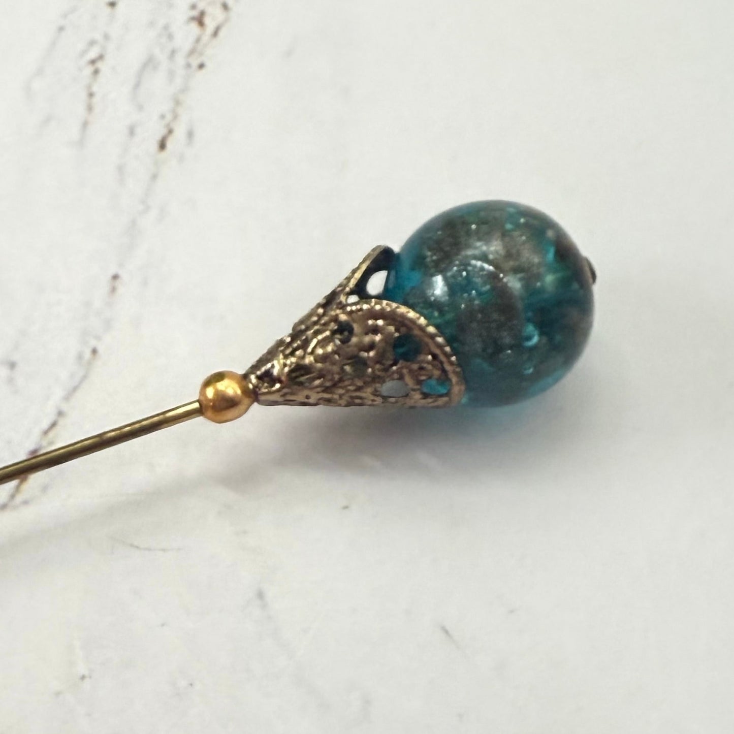 ✨ Handmade Vintage-Inspired Hatpin | Stick Pin | Hat Accessory | Sweater & Hijab Pin | Decorative Jewelry Gift for Her ✨

Vintage-Style Aqua Blue Glass Embedded Metallic Flecks Filigree Cone Base Hatpin - 6 inch