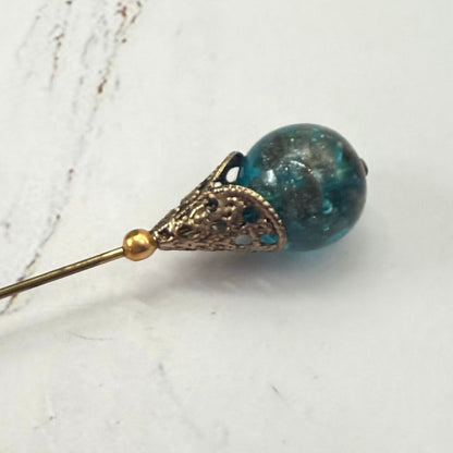 ✨ Handmade Vintage-Inspired Hatpin | Stick Pin | Hat Accessory | Sweater & Hijab Pin | Decorative Jewelry Gift for Her ✨

Vintage-Style Aqua Blue Glass Embedded Metallic Flecks Filigree Cone Base Hatpin - 6 inch