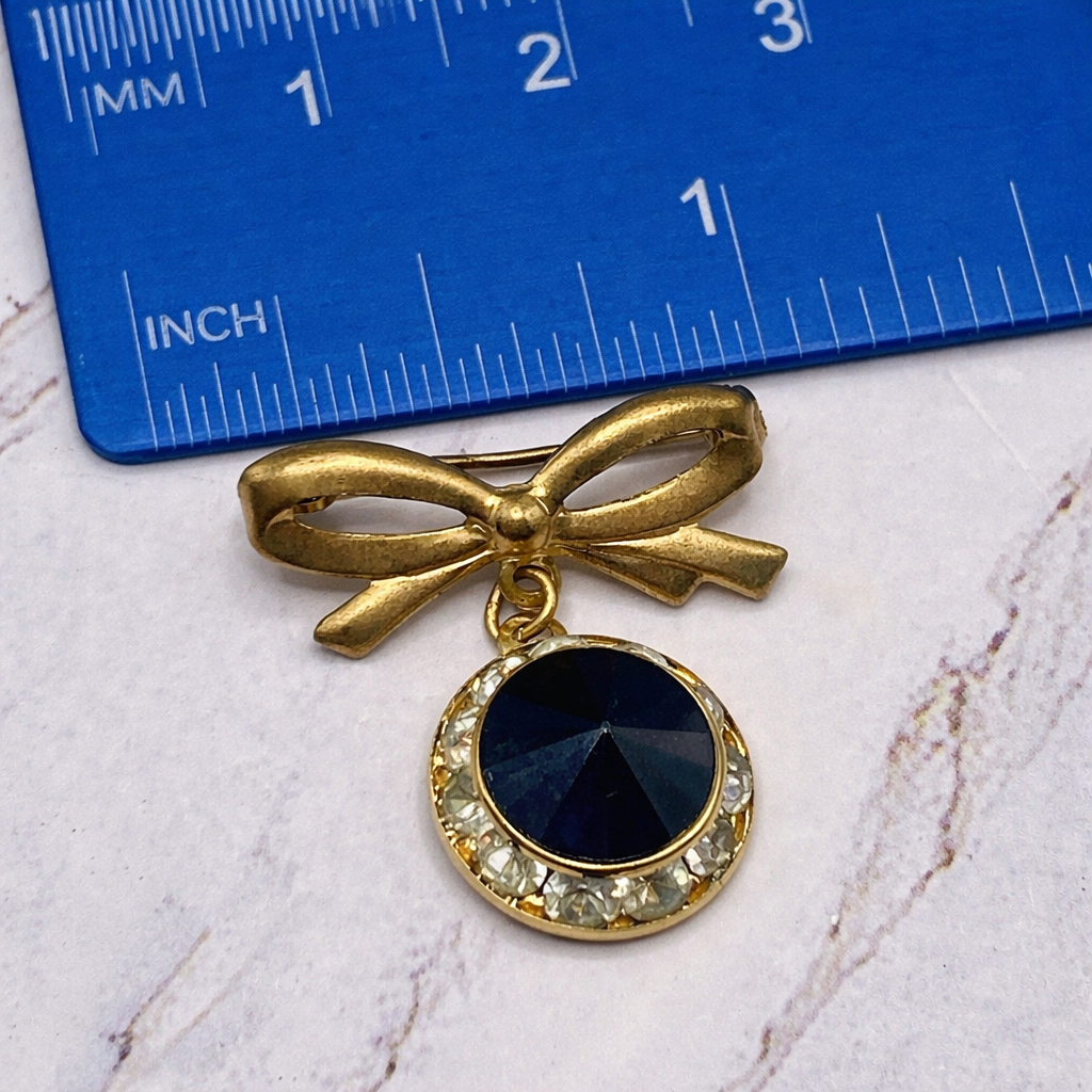 Gold Tone Bow Pin Black & Clear Rhinestone Dangle Doll Brooch