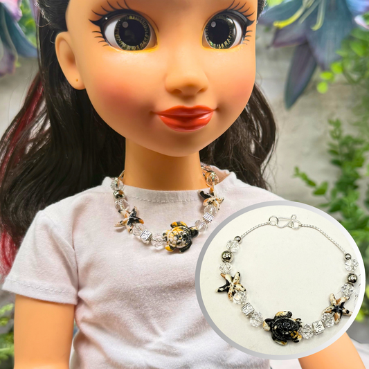 ✨Handmade Doll Jewelry Designed to Fit popular 18 Inch Fashion Dolls: add a little “Summer Fun ☀️ Beachy Style 🏝️” to your favorite doll!✨

Black Yellow Starfish Sea Turtle Charm Clear Crystal Beaded Doll Necklace