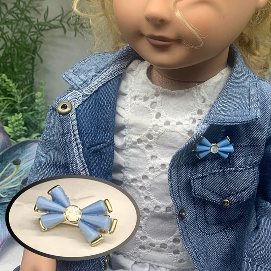 Doll Brooch / Pin for 18-20” Fashion Dolls: add a stylish touch to your favorite doll! 
Blue Acrylic Bow Shape Clear Rhinestone Accent Gold Pin Doll Brooch. The bow measures 1” x 1/2”wide