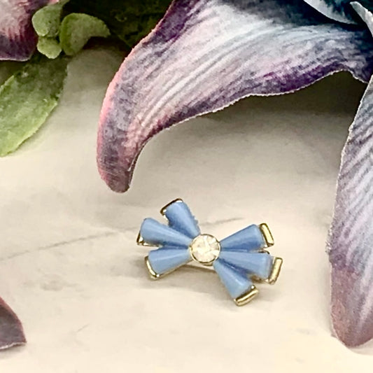 Doll Brooch / Pin for 18-20” Fashion Dolls: add a stylish touch to your favorite doll! 
Blue Acrylic Bow Shape Clear Rhinestone Accent Gold Pin Doll Brooch. The bow measures 1” x 1/2”wide