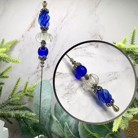 ✨Handmade Vintage Inspired Hatpin, Stick Pin, Gifts for Her, Hat Accessory, Jewelry Decor✨

Blue & Clear Swirl Glass With Silver tone Filigree Design - Hatpin measures 8.75” long
