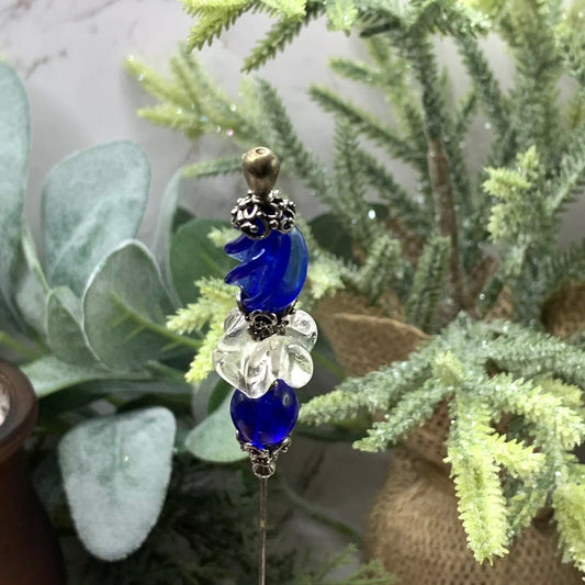 ✨Handmade Vintage Inspired Hatpin, Stick Pin, Gifts for Her, Hat Accessory, Jewelry Decor✨

Blue & Clear Swirl Glass With Silver tone Filigree Design - total pin measures 8.75” long.