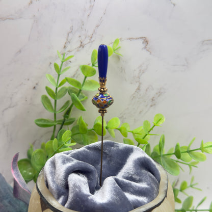 ✨Handmade Vintage Inspired Hatpin, Stick Pin, Gifts for Her, Hat Accessory, Jewelry Decor✨

Blue Glass Tapered Final Multi Color Floral Design Cloisonné Gold Tone Filigree Accent Hatpin - 6 Inch
