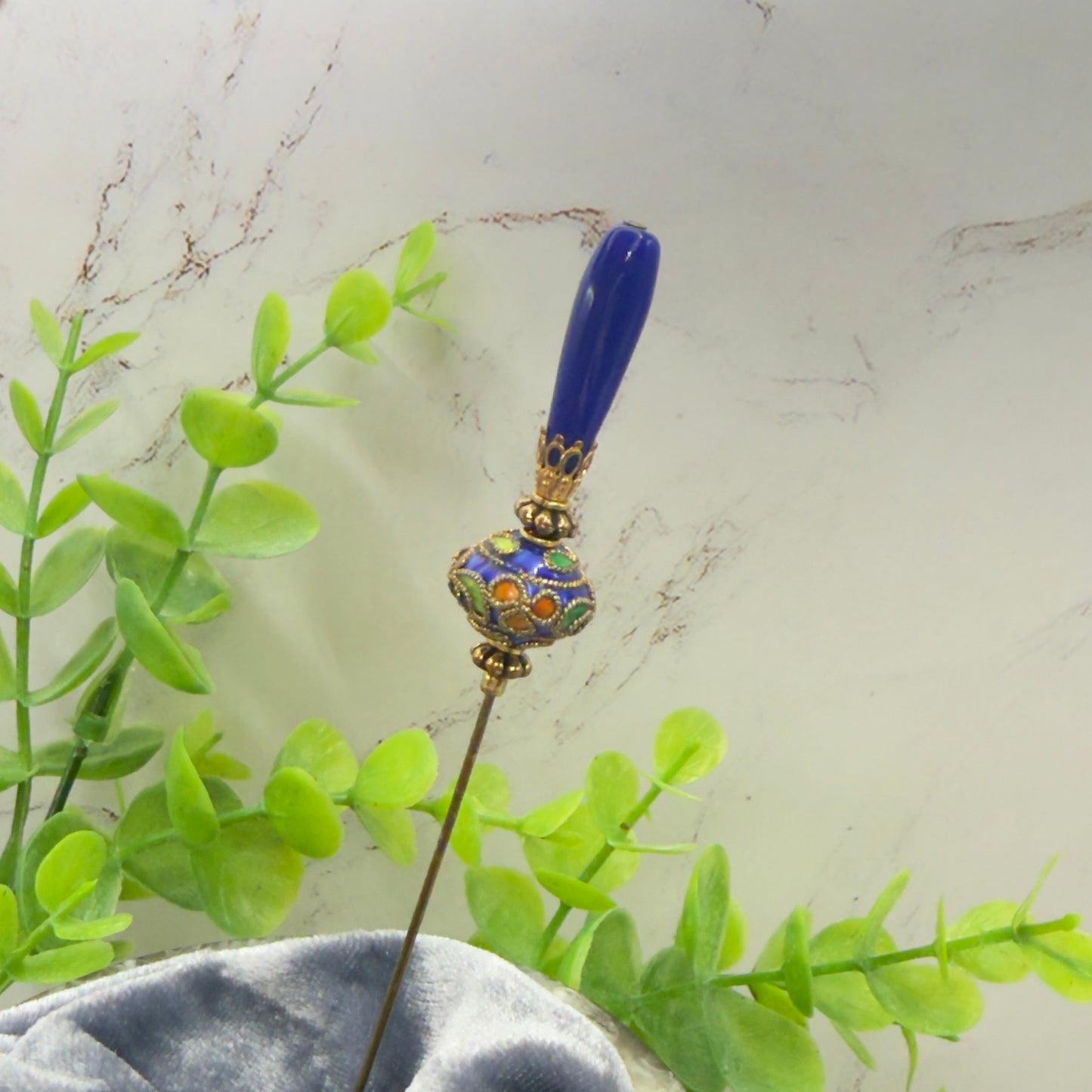 ✨Handmade Vintage Inspired Hatpin, Stick Pin, Gifts for Her, Hat Accessory, Jewelry Decor✨

Blue Glass Tapered Final Multi Color Floral Design Cloisonné Gold Tone Filigree Accent Hatpin - 6 Inch