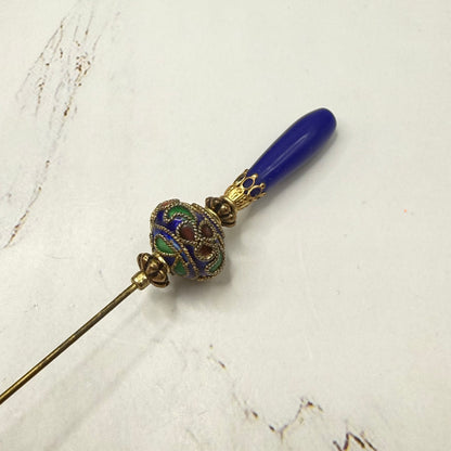 ✨Handmade Vintage Inspired Hatpin, Stick Pin, Gifts for Her, Hat Accessory, Jewelry Decor✨

Blue Glass Tapered Final Multi Color Floral Design Cloisonné Gold Tone Filigree Accent Hatpin - 6 Inch