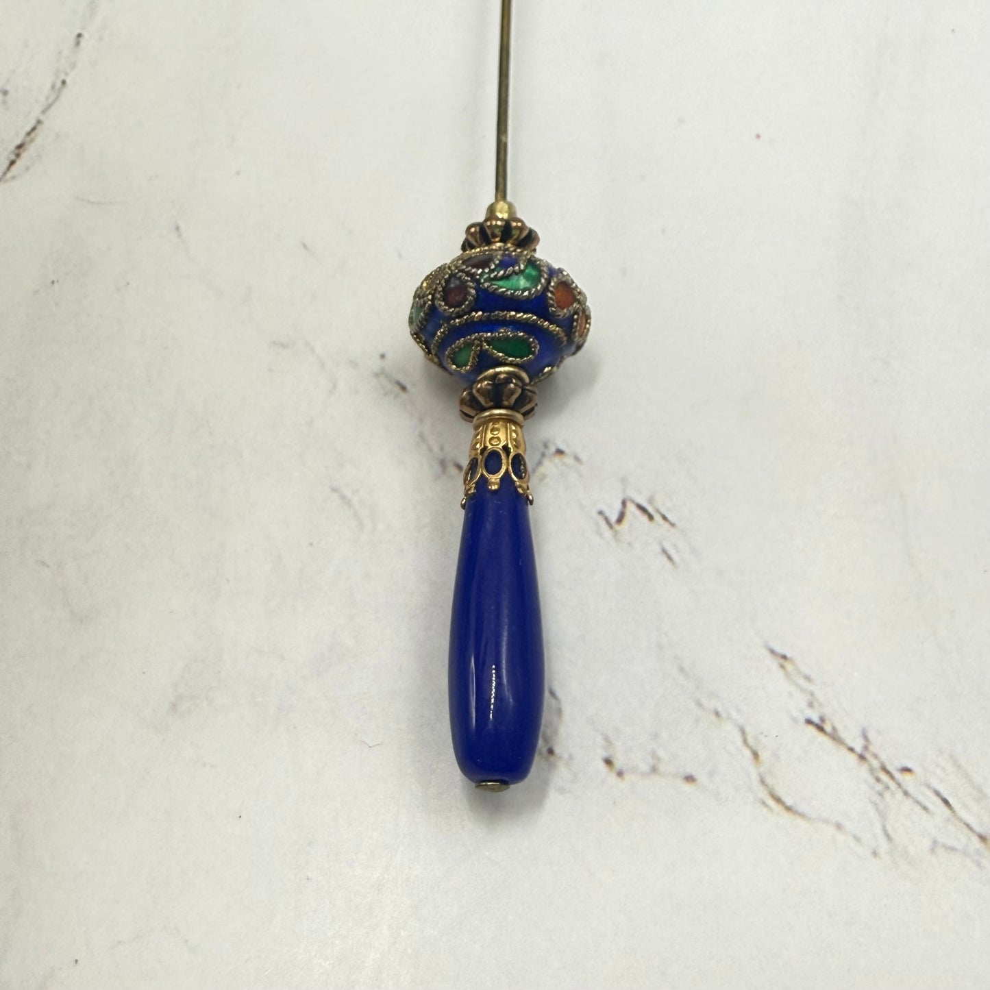 ✨Handmade Vintage Inspired Hatpin, Stick Pin, Gifts for Her, Hat Accessory, Jewelry Decor✨

Blue Glass Tapered Final Multi Color Floral Design Cloisonné Gold Tone Filigree Accent Hatpin - 6 Inch