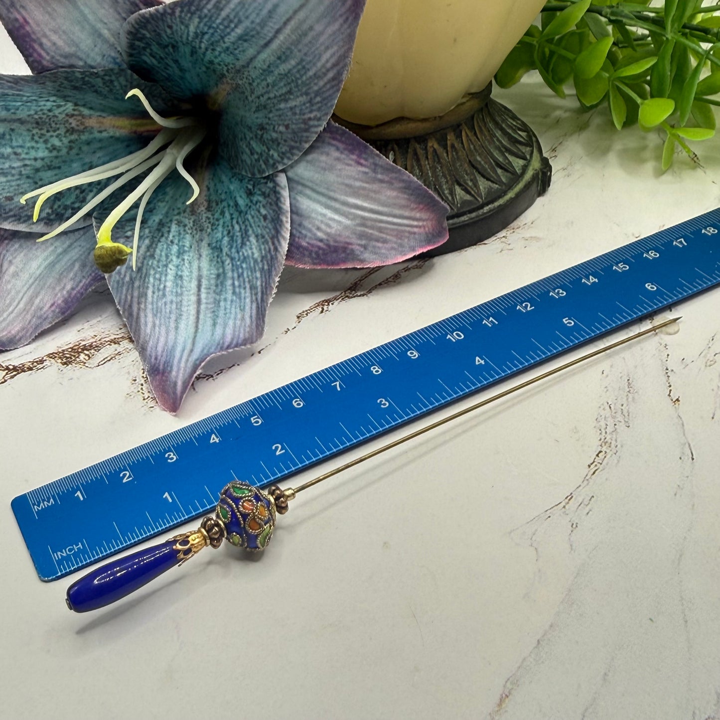 ✨Handmade Vintage Inspired Hatpin, Stick Pin, Gifts for Her, Hat Accessory, Jewelry Decor✨

Blue Glass Tapered Final Multi Color Floral Design Cloisonné Gold Tone Filigree Accent Hatpin - 6 Inch