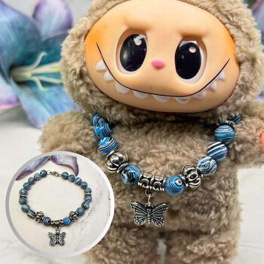 ✨Handmade Jewelry Designed to fit popular 17 to 20 cm (6 to 7 inch) Plushie Labubu Monster Dolls: add a stylish touch to your favorite plushie! ✨

Blue White Black Swirl Glass Beaded Silver Butterfly Charm Necklace
