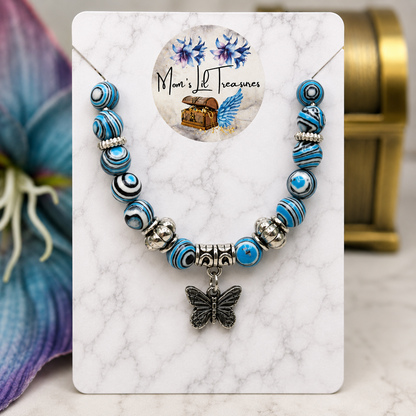 ✨Handmade Jewelry Designed to fit popular 17 to 20 cm (6 to 7 inch) Plushie Labubu Monster Dolls: add a stylish touch to your favorite plushie! ✨

Blue White Black Swirl Glass Beaded Silver Butterfly Charm Necklace