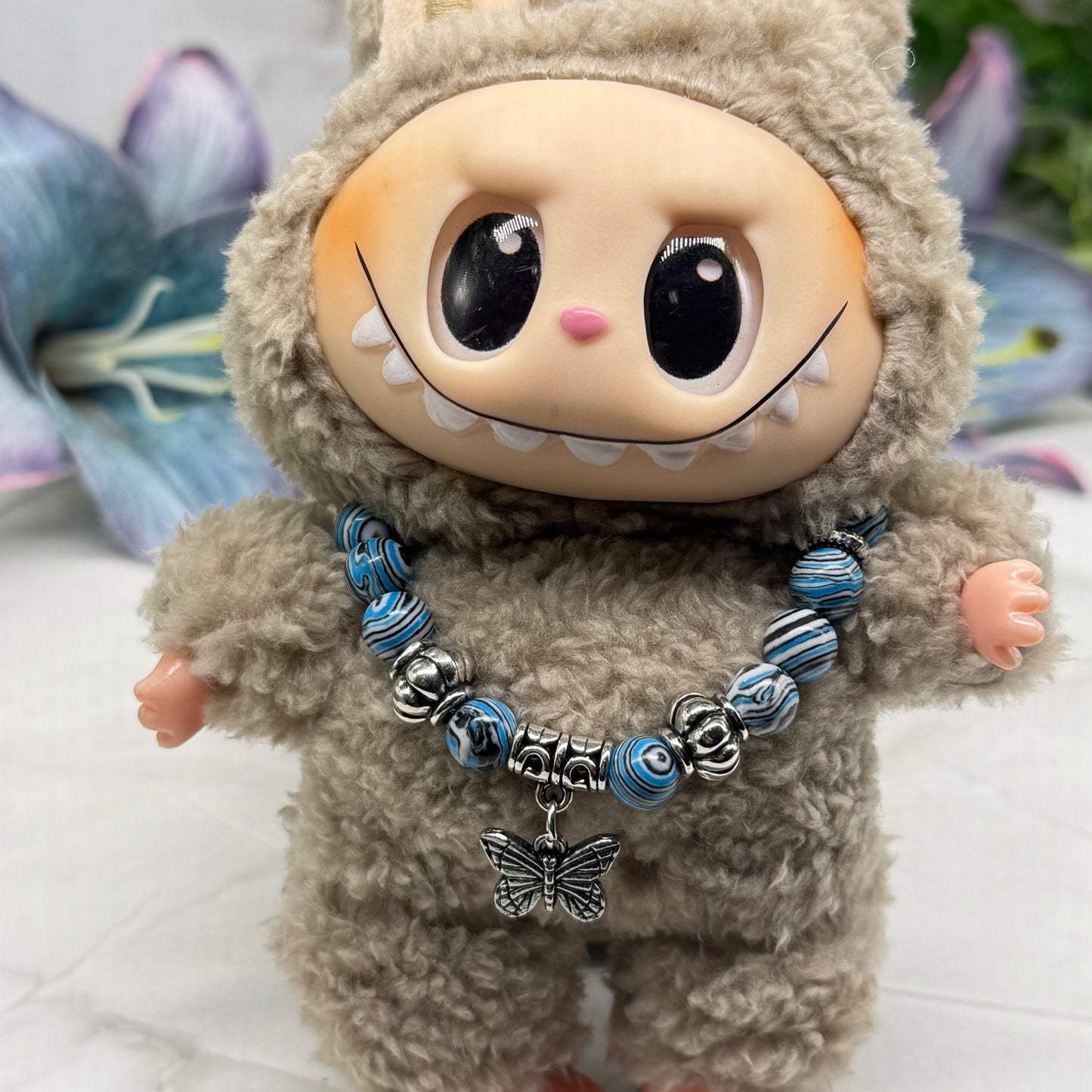 ✨Handmade Jewelry Designed to fit popular 17 to 20 cm (6 to 7 inch) Plushie Labubu Monster Dolls: add a stylish touch to your favorite plushie! ✨

Blue White Black Swirl Glass Beaded Silver Butterfly Charm Necklace