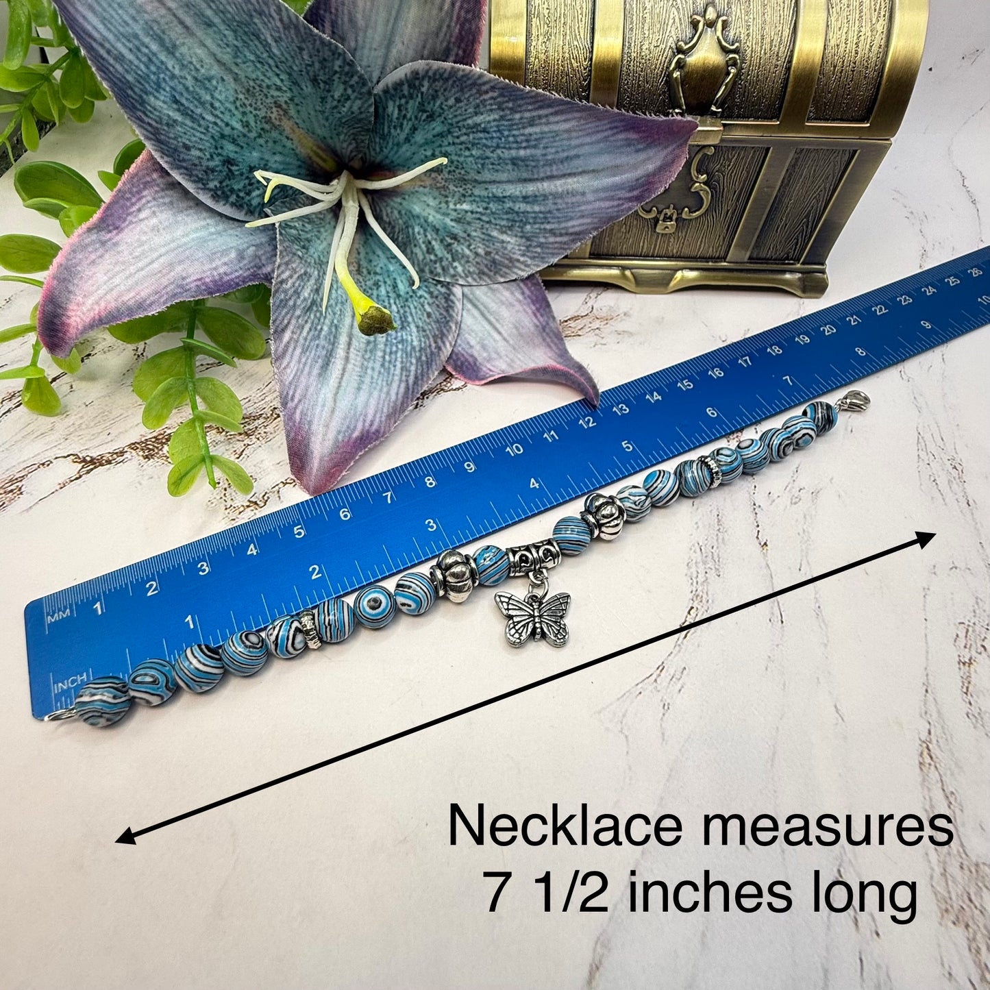 ✨Handmade Jewelry Designed to fit popular 17 to 20 cm (6 to 7 inch) Plushie Labubu Monster Dolls: add a stylish touch to your favorite plushie! ✨

Blue White Black Swirl Glass Beaded Silver Butterfly Charm Necklace