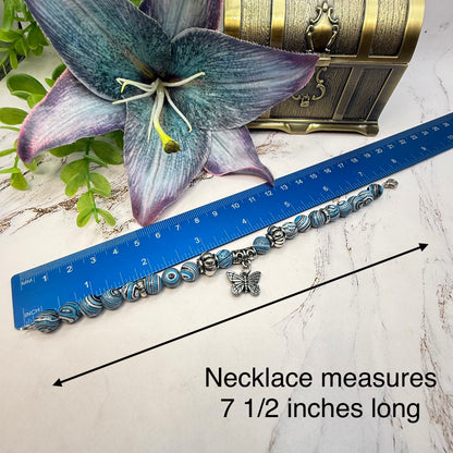 ✨Handmade Jewelry Designed to fit popular 17 to 20 cm (6 to 7 inch) Plushie Labubu Monster Dolls: add a stylish touch to your favorite plushie! ✨

Blue White Black Swirl Glass Beaded Silver Butterfly Charm Necklace