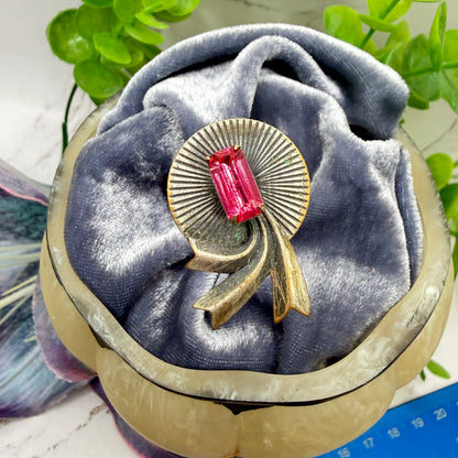 ✨ Handmade Vintage-Inspired Hatpin | Stick Pin | Hat Accessory | Sweater & Hijab Pin | Decorative Jewelry Gift for Her ✨

Brass / Bronze Tone Textured Metal Radiant Disc Fan Design with Ribbon Tails Rectangular Pink Rhinestone Center Accent - 3 Inch Hatpin / Stick Pin