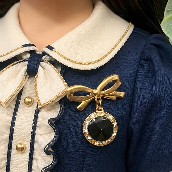 Gold Tone Bow Pin Black & Clear Rhinestone Dangle Doll Brooch