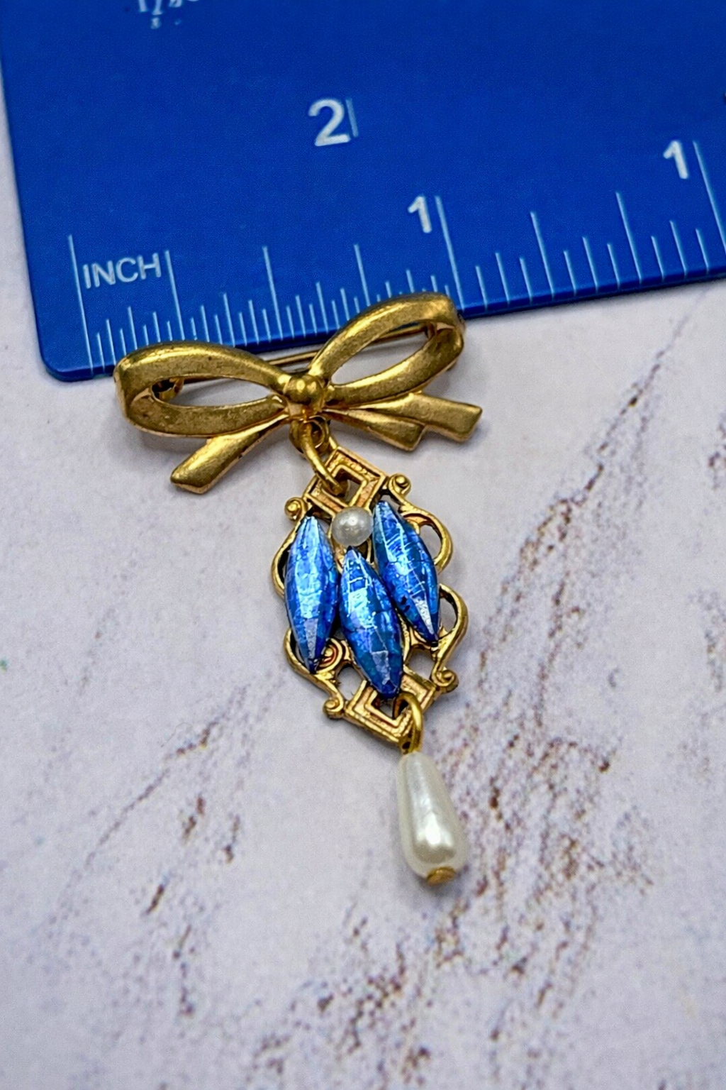 Gold Tone Pin Blue Rhinestone and Pearl Dangle Accent • Doll Brooch