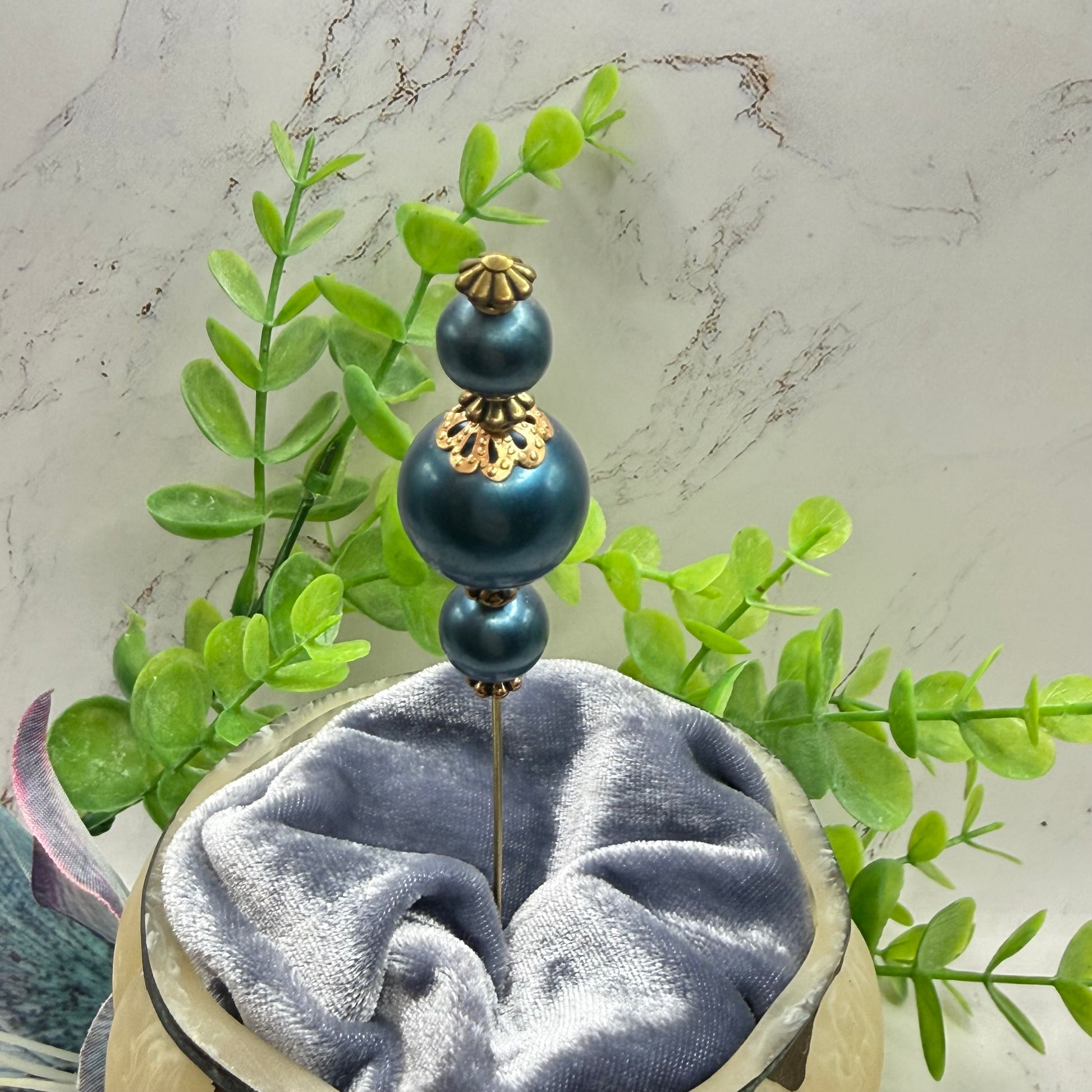 ✨ Handmade Vintage-Inspired Hatpin | Stick Pin | Hat Accessory | Sweater & Hijab Pin | Decorative Jewelry Gift for Her ✨

Dark Petrol Blue Faux Pearl Stacked Beads with Gold Tone Filigree Bead Accents Hatpin - 6 Inch