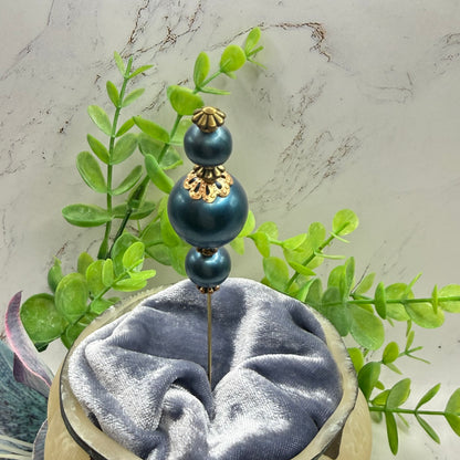 ✨ Handmade Vintage-Inspired Hatpin | Stick Pin | Hat Accessory | Sweater & Hijab Pin | Decorative Jewelry Gift for Her ✨

Dark Petrol Blue Faux Pearl Stacked Beads with Gold Tone Filigree Bead Accents Hatpin - 6 Inch