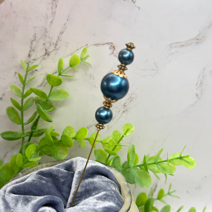 ✨ Handmade Vintage-Inspired Hatpin | Stick Pin | Hat Accessory | Sweater & Hijab Pin | Decorative Jewelry Gift for Her ✨

Dark Petrol Blue Faux Pearl Stacked Beads with Gold Tone Filigree Bead Accents Hatpin - 6 Inch