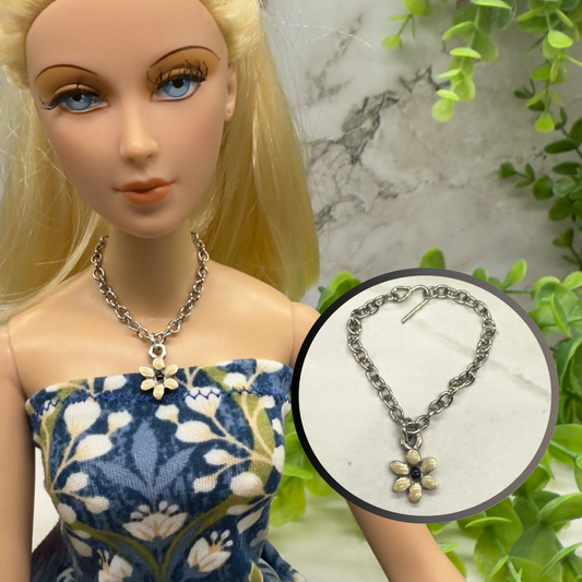 Beige Flower Pendant Silver Chain Doll Necklace. This necklace is 3.25 inches in length. Necklace shown on 16” Madame Alexander - Alex doll