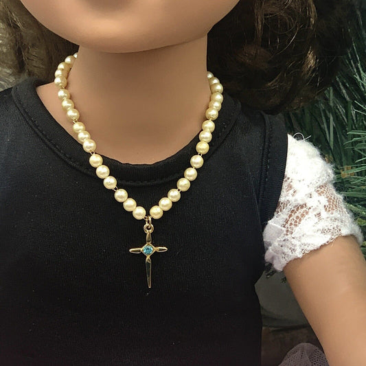 ✨Handmade Doll Jewelry Designed to Fit popular 18 Inch Fashion Dolls: add a touch of religious elegance and spirituality to your favorite doll!✨

Gold Cross Pendant with Turquoise Blue Rhinestone accent. 7.5 inch long, Chain Strung faux Pearl Doll Necklace.