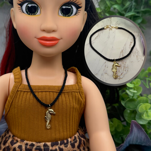 ✨Handmade Doll Jewelry Designed to Fit popular 18 Inch Fashion Dolls: add a little “Summer Fun ☀️ Beachy Style” to your favorite doll!✨

Gold Seahorse Pendant Black Fabric Cord Doll Necklace. Necklace measures 8.5 inches long.