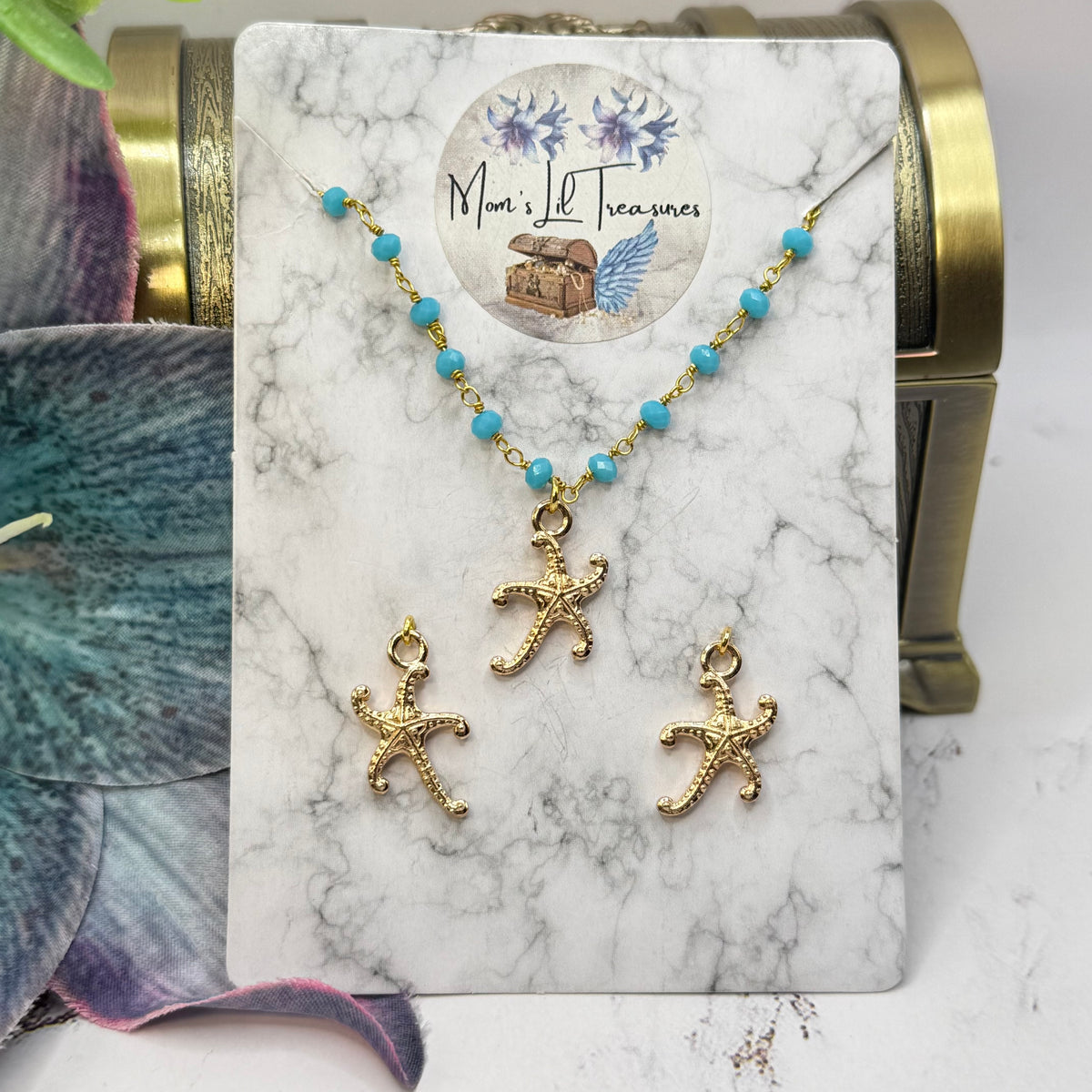 ✨Handmade Doll Jewelry Designed to Fit popular 18 Inch Fashion Dolls: add a little “Summer Fun ☀️ Beachy Style 🏝️” to your favorite doll!✨

Gold Starfish Charm Turquoise Blue Glass Beaded Doll Necklace & Earrings