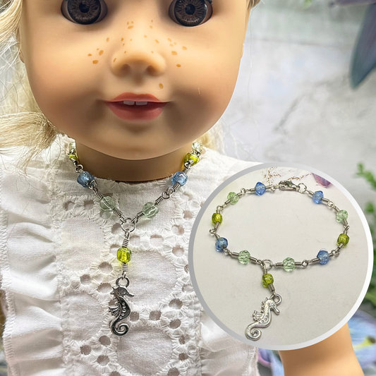✨Handmade Doll Jewelry Designed to Fit popular 18 Inch Fashion Dolls: add a little “Summer Fun ☀️ Beachy Style 🏝️” to your favorite doll!✨

Green Blue Glass Beaded Silver Link Chain Seahorse Charm Doll Necklace