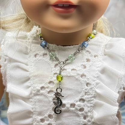✨Handmade Doll Jewelry Designed to Fit popular 18 Inch Fashion Dolls: add a little “Summer Fun ☀️ Beachy Style 🏝️” to your favorite doll!✨

Green Blue Glass Beaded Silver Link Chain Seahorse Charm Doll Necklace