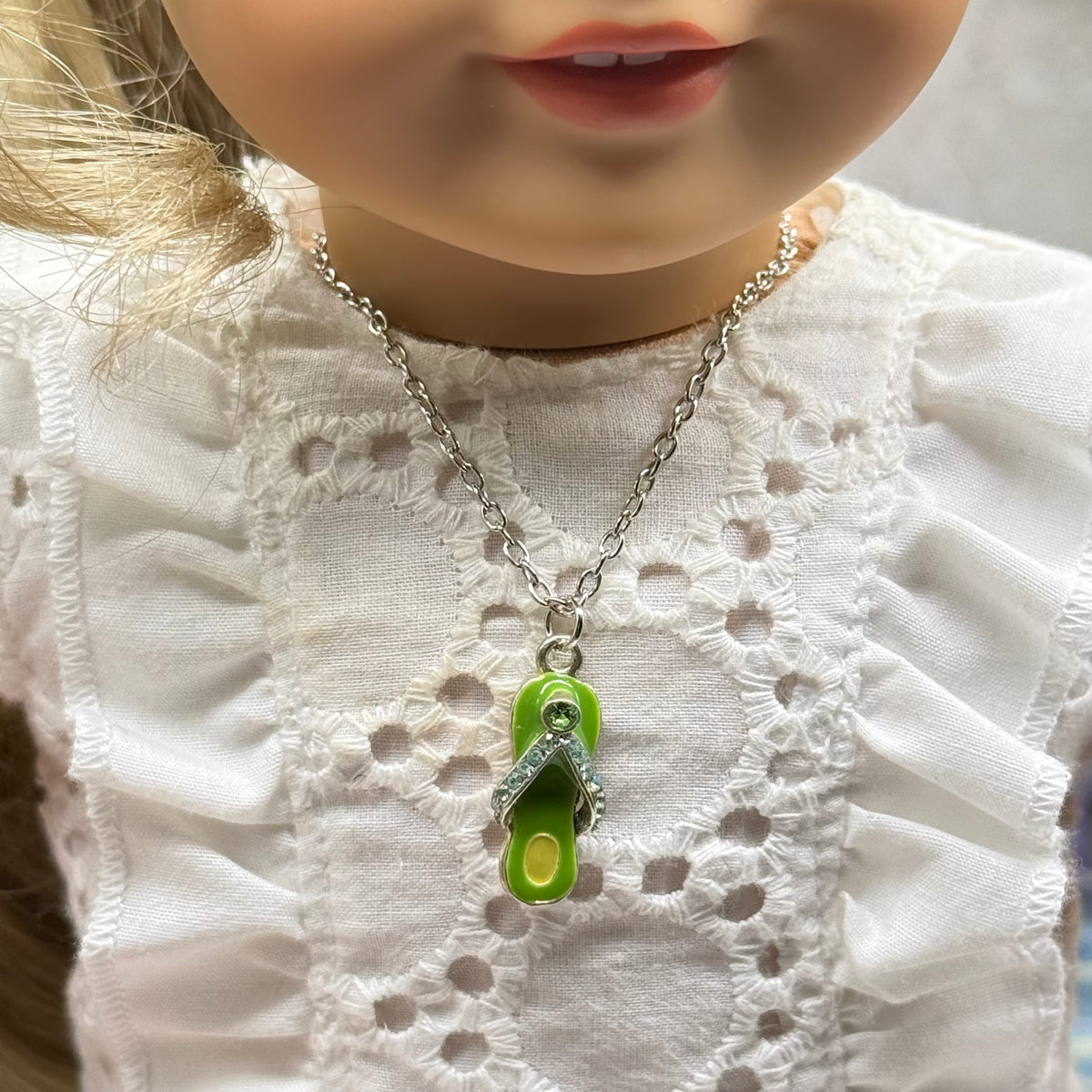 ✨Handmade Doll Jewelry Designed to Fit popular 18 Inch Fashion Dolls: add a little “Summer Fun ☀️” to your favorite doll!✨

Green Enamel Rhinestone Flip Flop Charm Silver Doll Necklace
