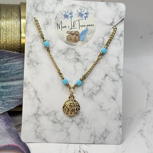 Handmade Doll Jewelry Designed to Fit popular 18 Inch Fashion Dolls: add a little “Summer Fun ☀️ Beachy Style 🏝️” to your favorite doll! Light Blue Bead Gold Starfish Sand Dollar Charm Doll Necklace