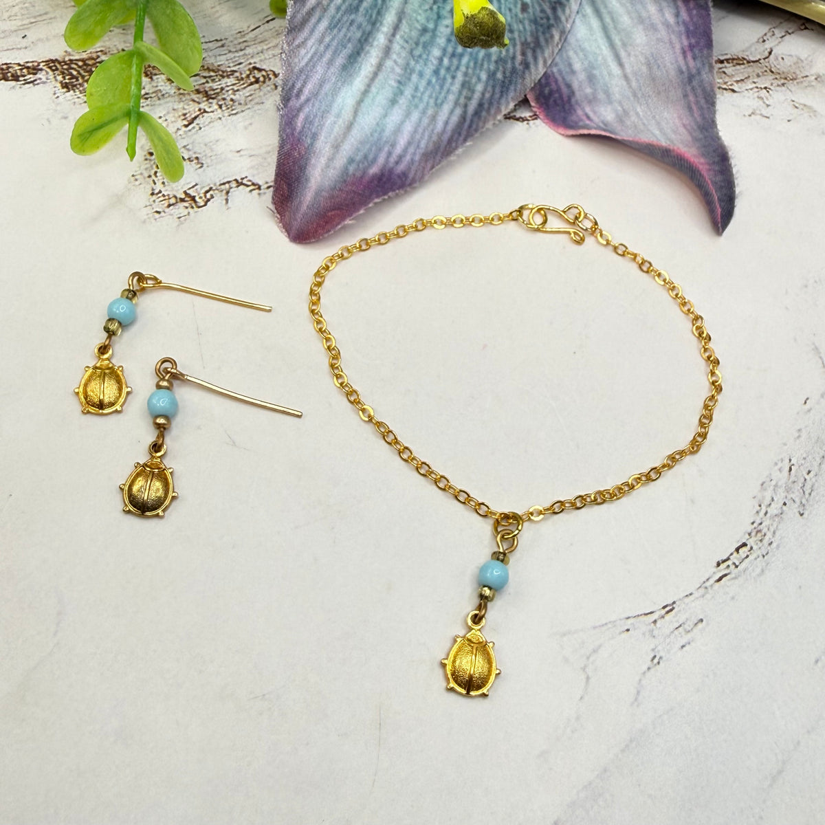 ✨ Handmade Doll Jewelry Designed to Fit popular 18 Inch Fashion Dolls: add a stylish touch to your favorite doll ✨

Light Blue Glass Gold Lady Bug Charm Doll Necklace & Matching Earrings Set