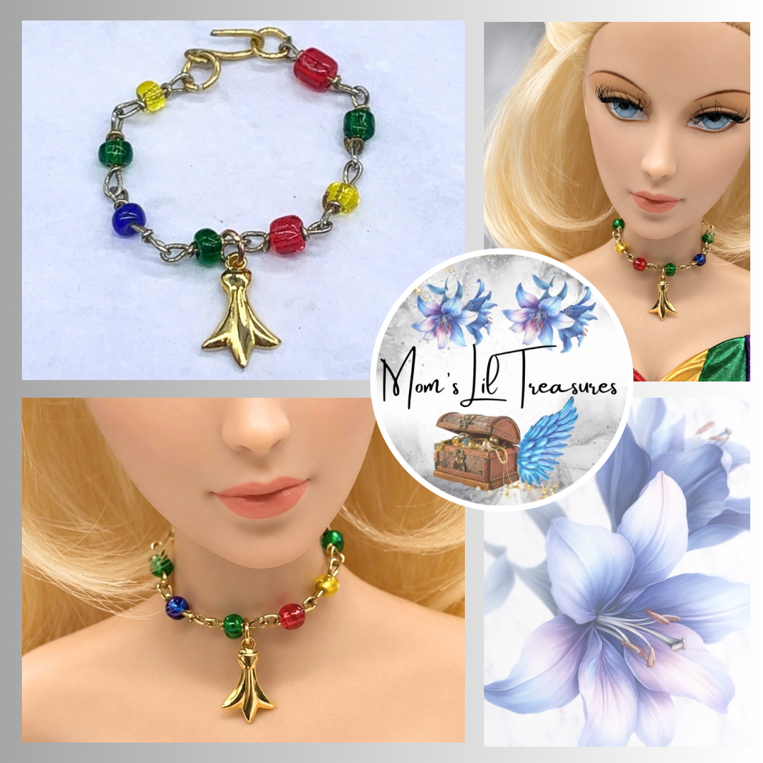Dress up your favorite doll with this Multi Color Glass Bead Gold Charm Doll Necklace. This necklace is 2-3/4 inches in length. Necklace shown on 16” Madame Alexander - Alex doll