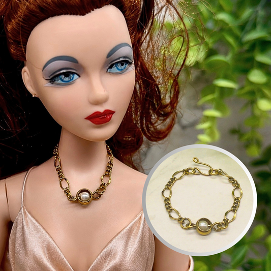 Pearl Accent Gold Large Link Chain Doll Necklace. The necklace is 3.25 inches long. Necklace shown on 16” Ashton Drake - Gene doll