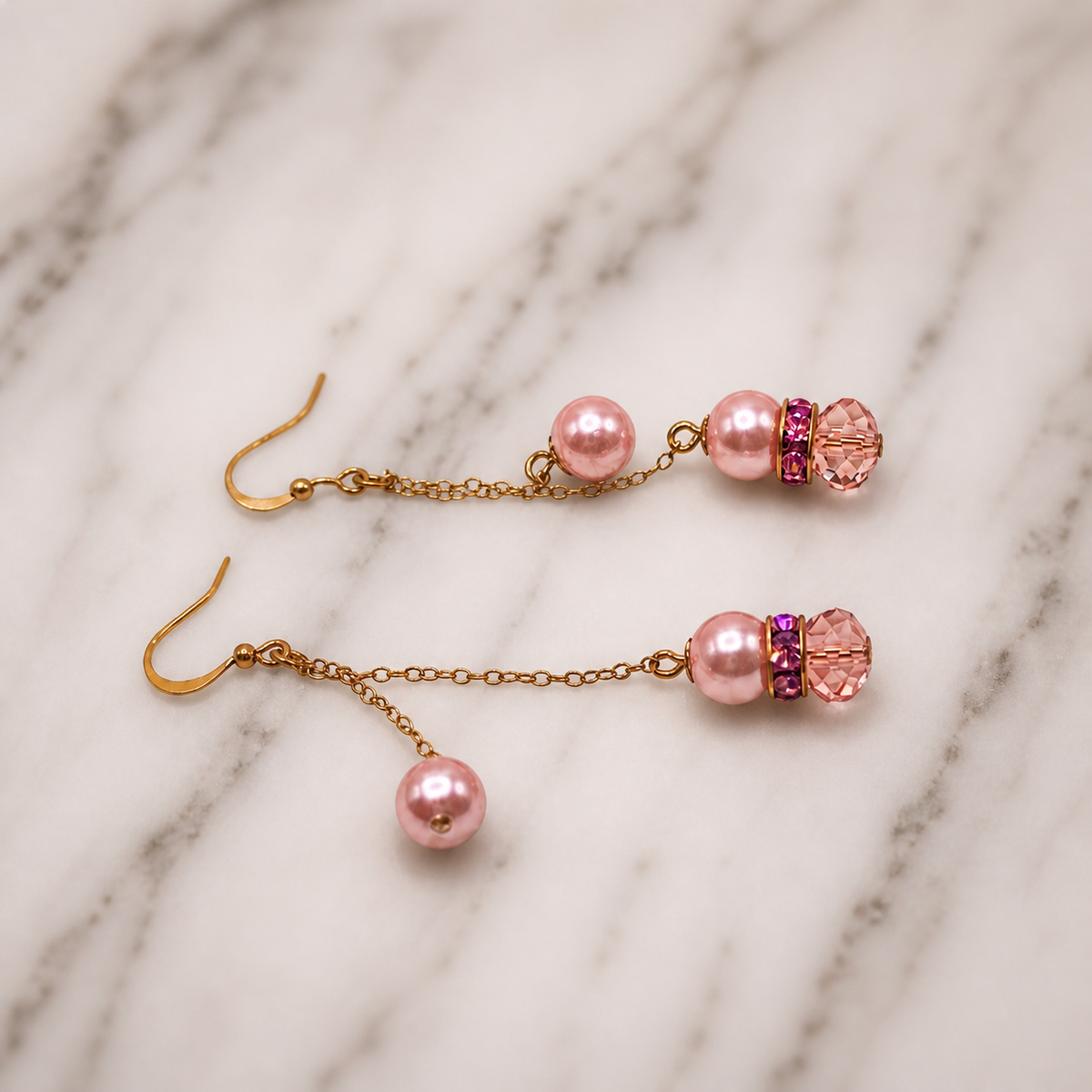 Pretty pink crystal, faux pearl, rhinestone and gold tone chain handmade dangle earrings. These earrings measure 2.5 inches long.