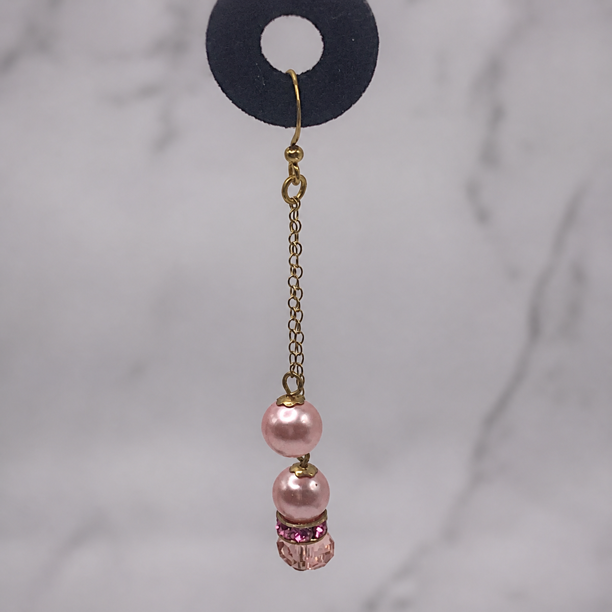 Pretty pink crystal, faux pearl, rhinestone and gold tone chain handmade dangle earrings. These earrings measure 2.5 inches long.