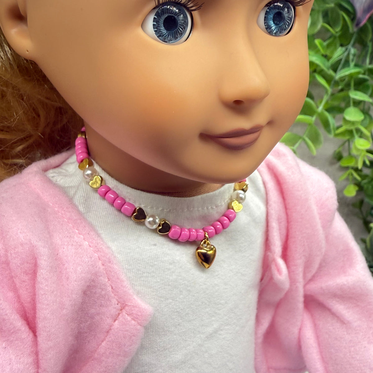 ✨Handmade Doll Jewelry Designed to Fit popular 18 Inch Fashion Dolls: add some “Valentine’s Day 💕” style to your favorite doll!✨Pink & Pearl Beaded Gold Heart Valentine’s Day Doll Necklace • Necklace measures 7-1/8 inches long • Doll Size / Scale: Pics included with necklace shown on 18" Our Generation doll (neck measures 6 inches around)