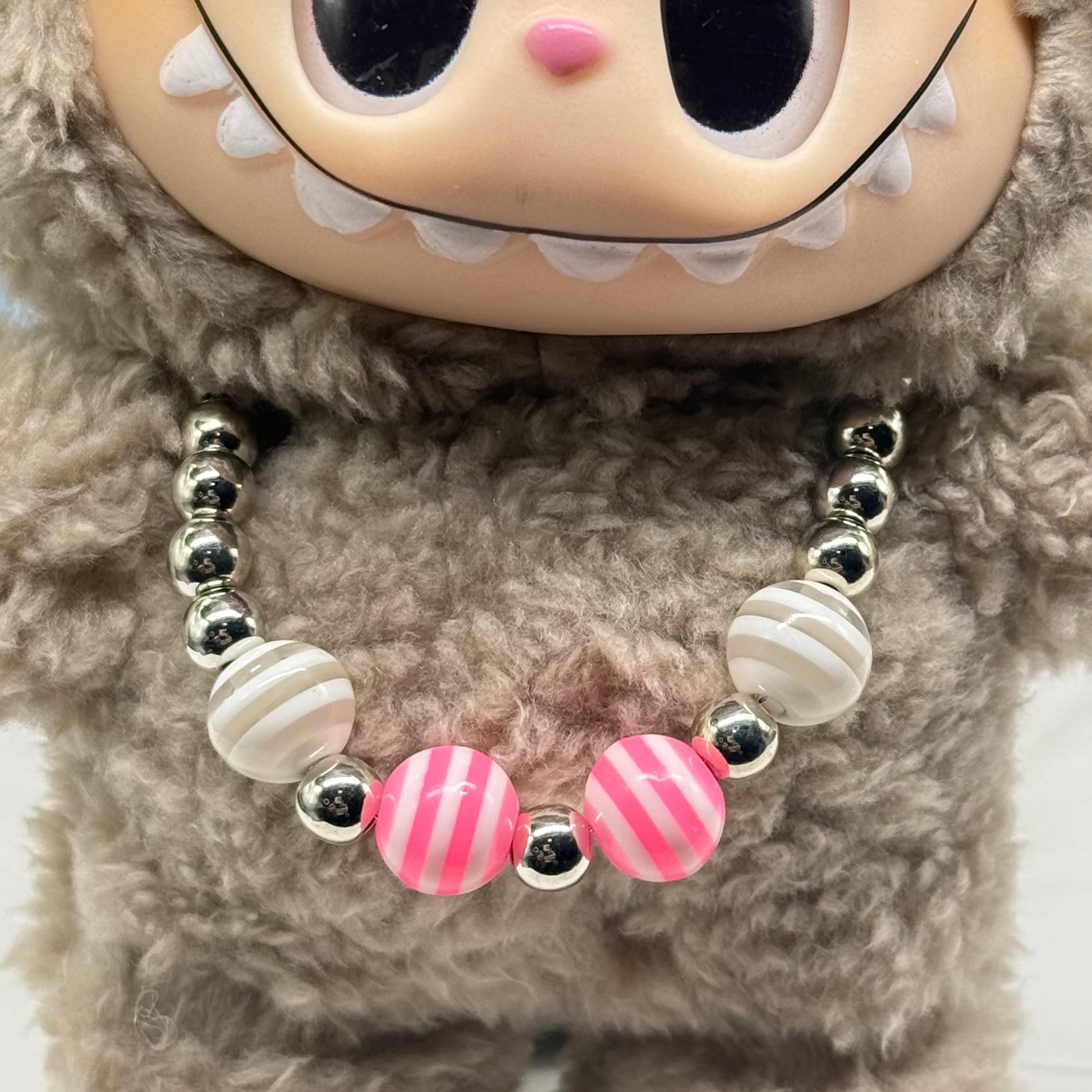 ✨Handmade Jewelry Designed to fit popular 17 to 20 cm (6 to 7 inch) Plushie Labubu Monster Dolls: add a stylish touch to your favorite plushie! ✨

Pink White Striped Ball Beaded Silver Necklace