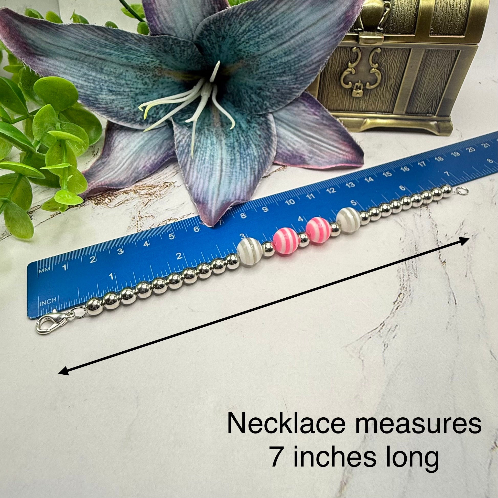 ✨Handmade Jewelry Designed to fit popular 17 to 20 cm (6 to 7 inch) Plushie Labubu Monster Dolls: add a stylish touch to your favorite plushie! ✨

Pink White Striped Ball Beaded Silver Necklace