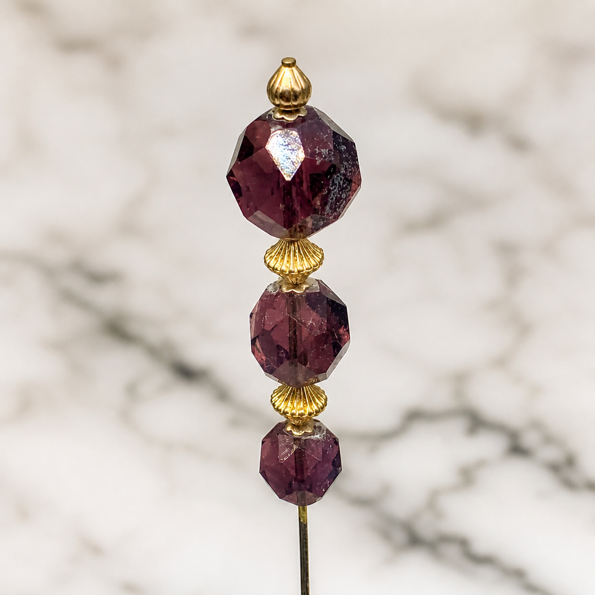 ✨Handmade Vintage Inspired Hatpin, Stick Pin, Gifts for Her, Hat Accessory, Jewelry Decor✨

Purple Amethyst Glass Crystal Bead Gold bead and filigree Accents. Total pin measures 8” long.