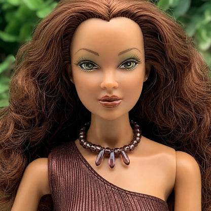 Purple glass beaded choker style necklace with teardrop shaped dangles. Made with bendable gold tone wire. Necklace shown on 16” Spellbound Valentina doll