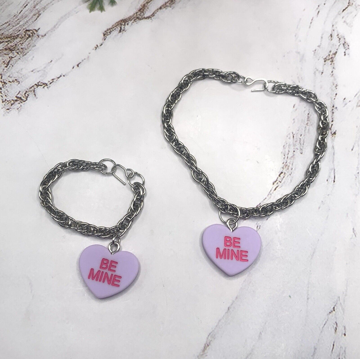 ✨Handmade Doll Jewelry Designed to Fit popular 18 Inch Fashion Dolls: add a stylish touch to your favorite doll!✨

Purple Acrylic Heart “Be Mine” Charm on Silver tone chain Necklace Bracelet Set. The necklace measures 6-3/4” long and bracelet is 3-3/8” long.