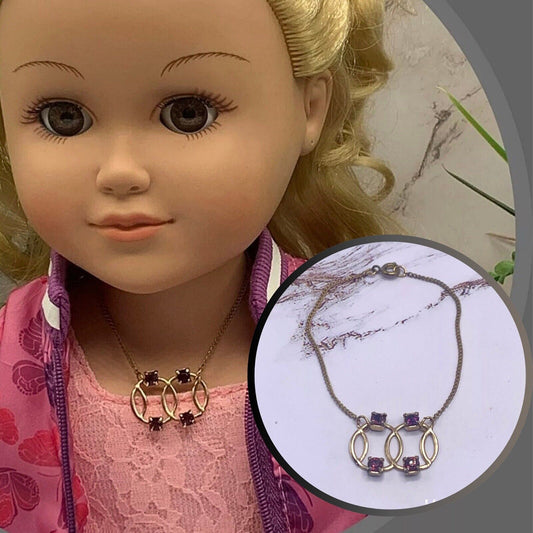 ✨Handmade Doll Jewelry Designed to Fit popular 18 Inch Fashion Dolls: add a stylish touch to your favorite doll!✨
Purple Rhinestone Gold Circle Design Pendant Doll Necklace  • necklace measures 6.5 inches long • necklace shown on 18" My Life As doll (Neck measures 5.5" around)

